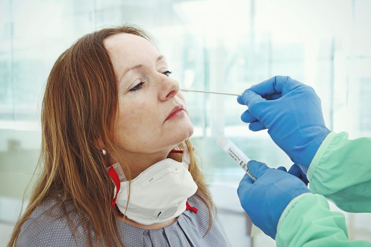 Medic taking sample from patients nose for coronavirus testing